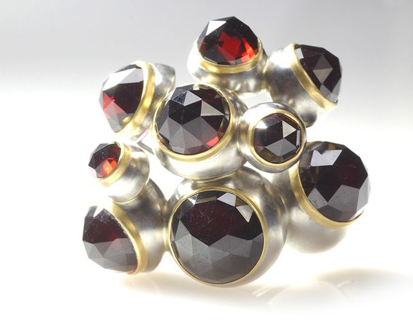 Lola Brooks, garnet blisters, 2002, brooch, stainless steel, vintage rose-cut garnets, 18-karat gold, Dimensions, private collection, photo: Kevin Sprague