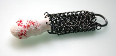 Shu-Lin Wu, GCC no.3, 2014, ring/finger ornament, porcelain, silver, 120 x 30 x x 21 mm, photo: artist Shi-Lin Wu